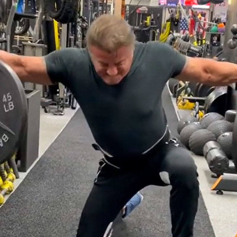 75 years old Stallone  grabbing two 45 lbs